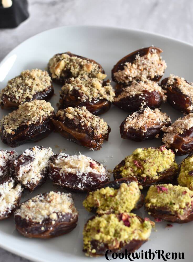 4 types of Stuffed Dates served in a white square plate.
