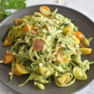 Zoodles salad served in grey plate.