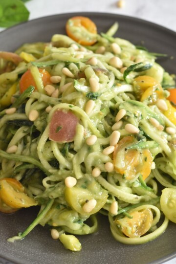 Zoodles salad served in grey plate.