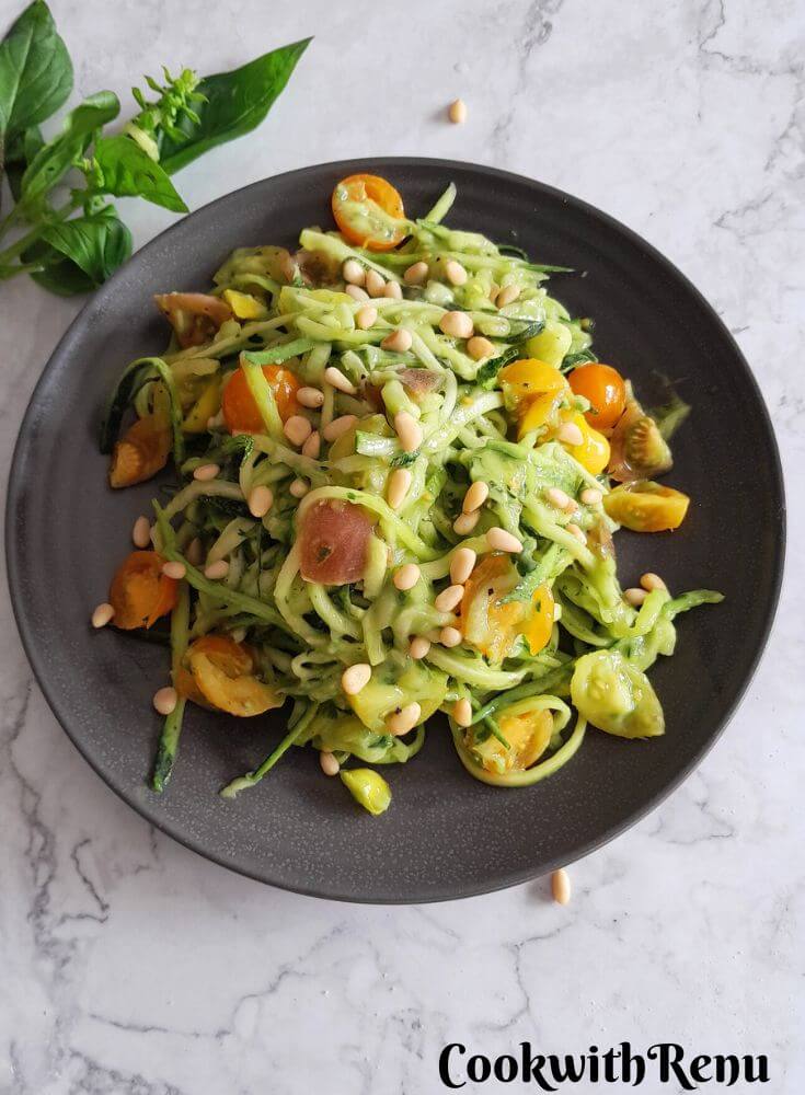 Zoodles salad served in grey plate.
