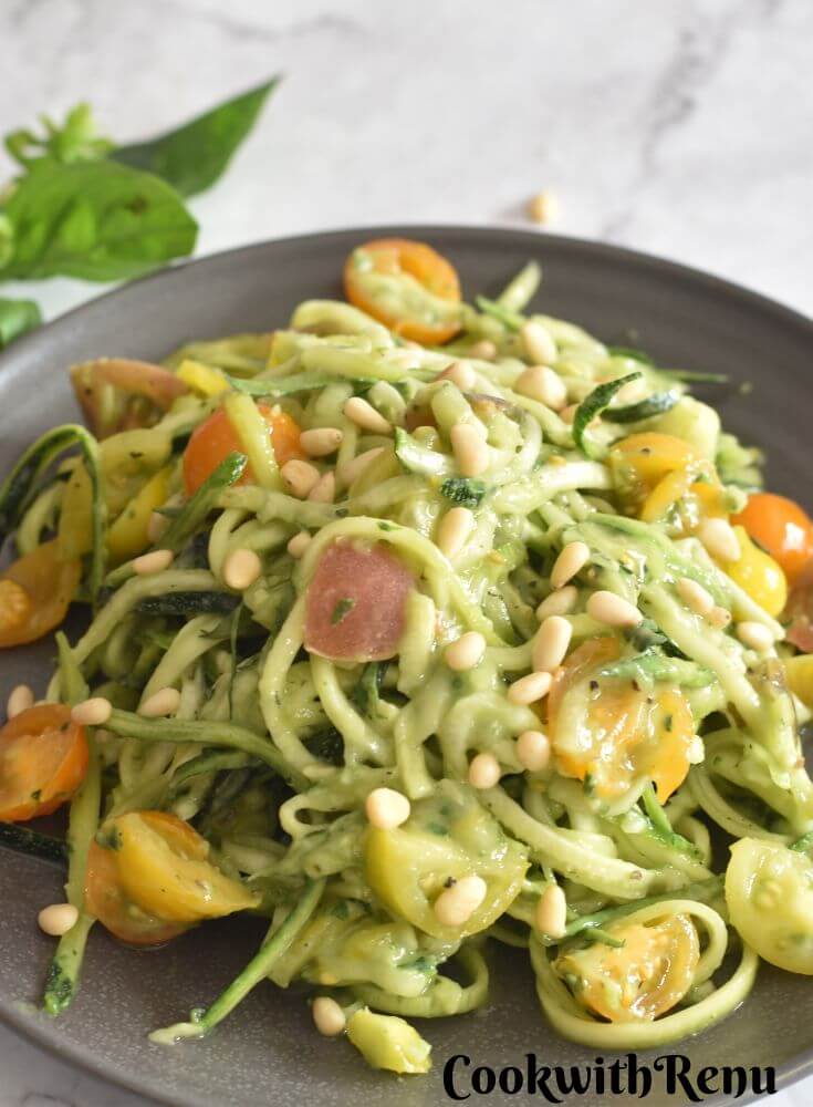 Zoodles salad served in grey plate.