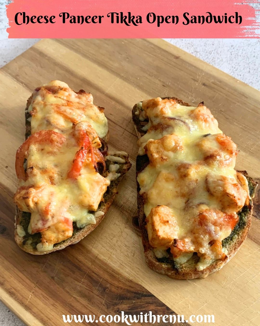 2 slices of Cheese Paneer Tikka Open Sandwich on a cheese board, just baked from air-fryer.