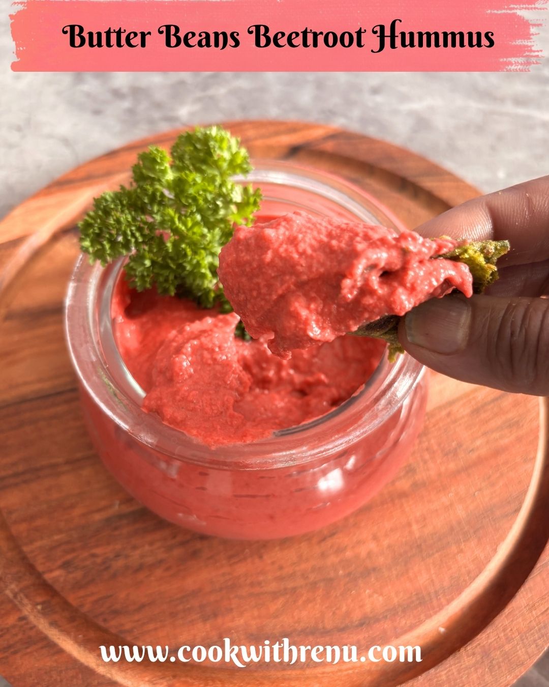 Image showing a close-up look of butter beans, beetroot hummus, dipped in a roti.