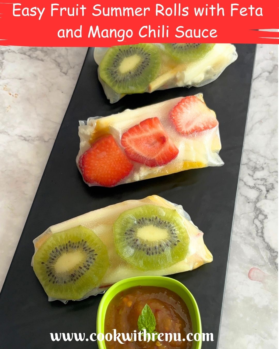 Three Fruit Summer Rolls served on a black tray and some mango chili sauce as a dip.