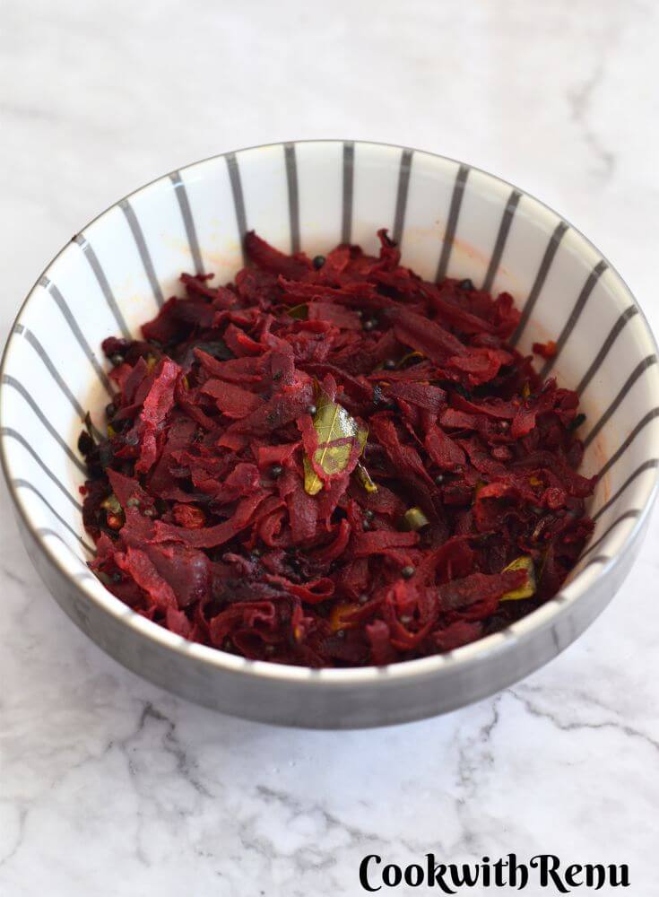 Beetroot Stir Fry served in a white bowl with grey lining.