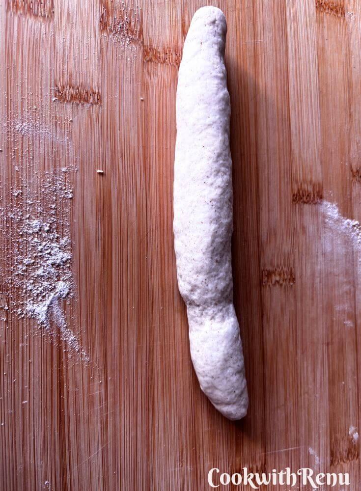 Rolling Dough on a board.