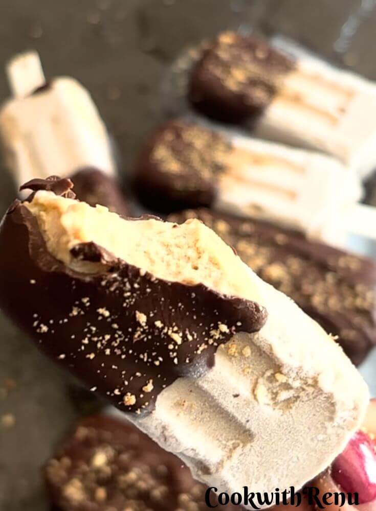 Close look of High Protein Banana Peanut Butter Ice Cream, with a bite taken revealing the internal texture.