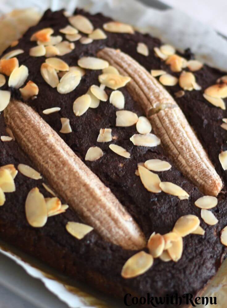 Close-Up look of Gluten-Free Chocolate Banana Cake with Coconut Flour on parchment paper.