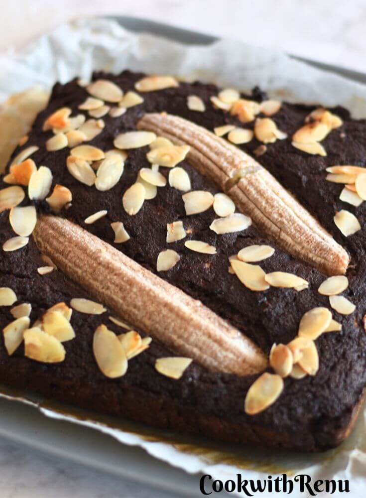 Close-up look of Gluten-Free Chocolate Banana Cake with Coconut Flour on parchment paper.