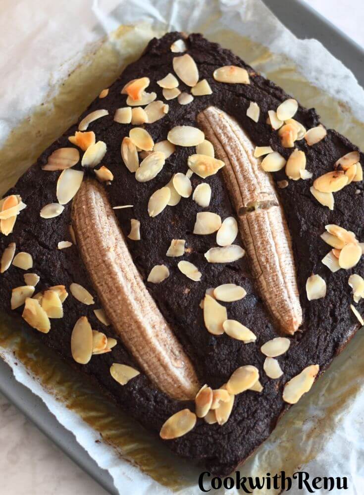 Close-up look of Gluten-Free Chocolate Banana Cake with Coconut Flour on parchment paper.