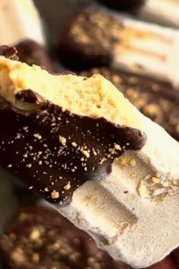 Close look of High Protein Banana Peanut Butter Ice Cream, with a bite taken revealing the internal texture.