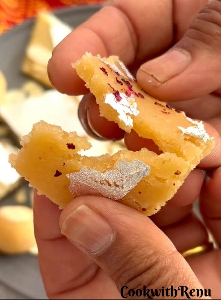 Pic showing a badam burfi cut into half showing the inside texture.