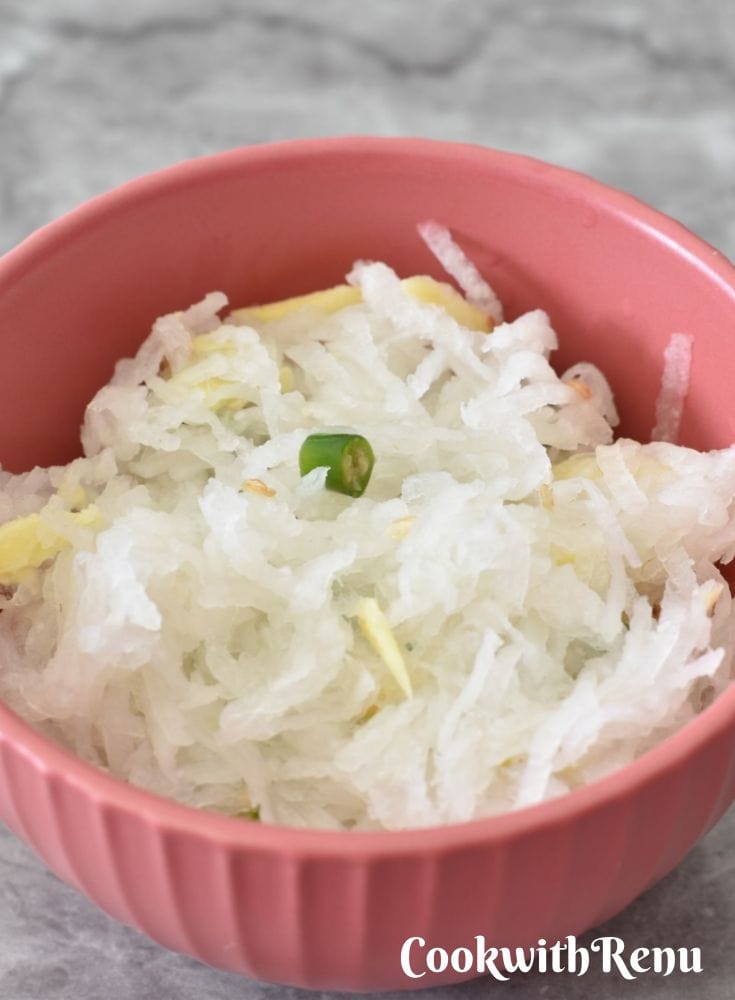 Mooli Salad in a reddish ping cup.